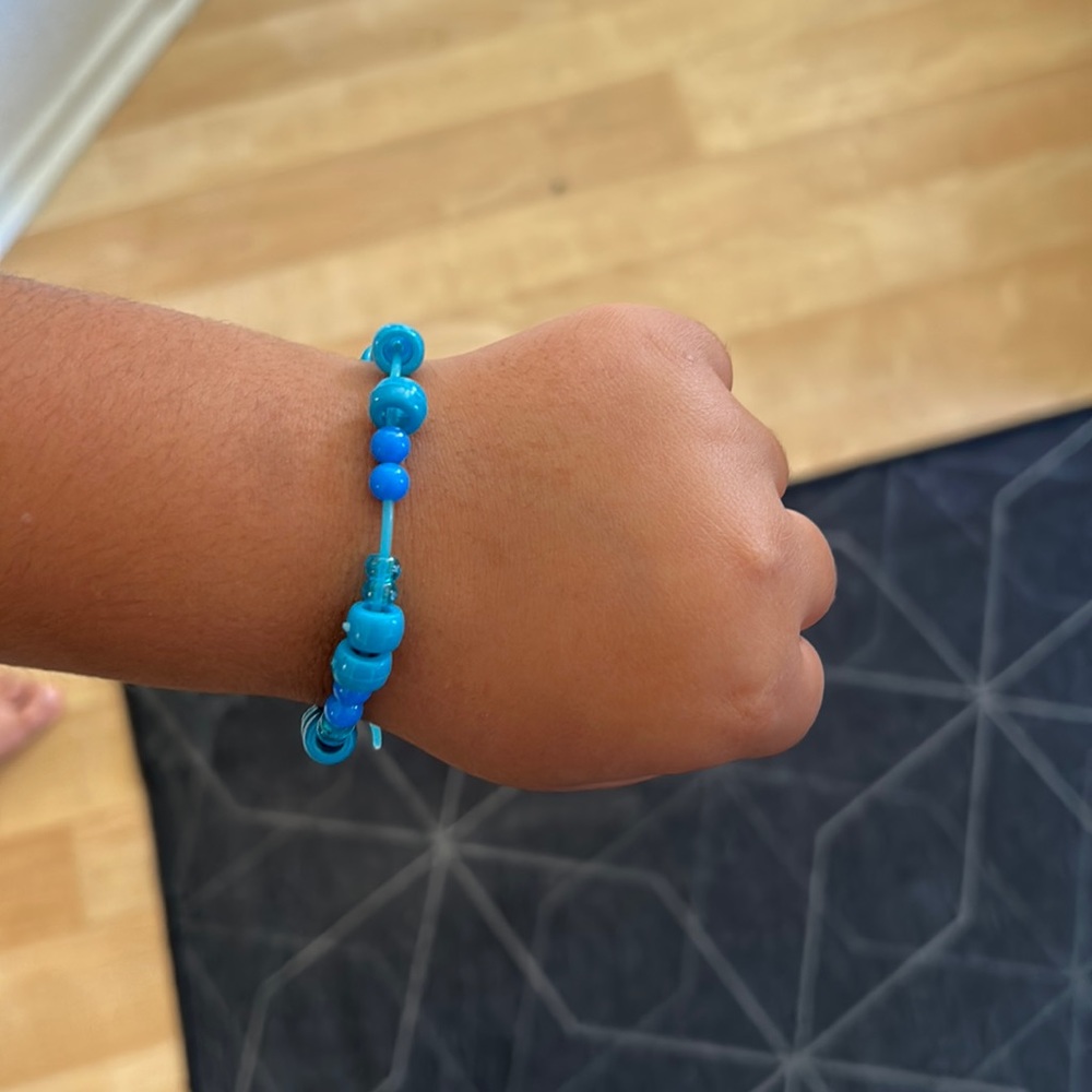 Making custom bracelets. Any color,bead,string, or charm you want just comment!